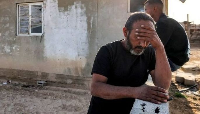Mohamad Hassouna, 49, reacts as he stands outside a building where his seven-year-old daughter Amina was injured by an incoming projectile at their Bedouin village, not recognised by Israeli authorities, in the southern Negev desert on April 14, 2024. Iran launched more than 300 drones and missiles towards Israel in its unprecedented attack overnight, injuring at least 12 people, an Israeli army spokesman said on April 14.