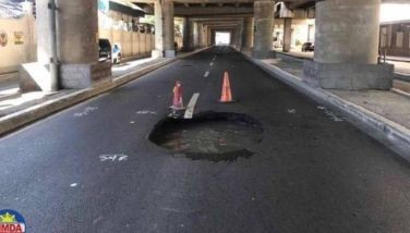 This photo shows a picture of the &quot;sinkhole&quot; formed at Sales Road in Pasay City. 