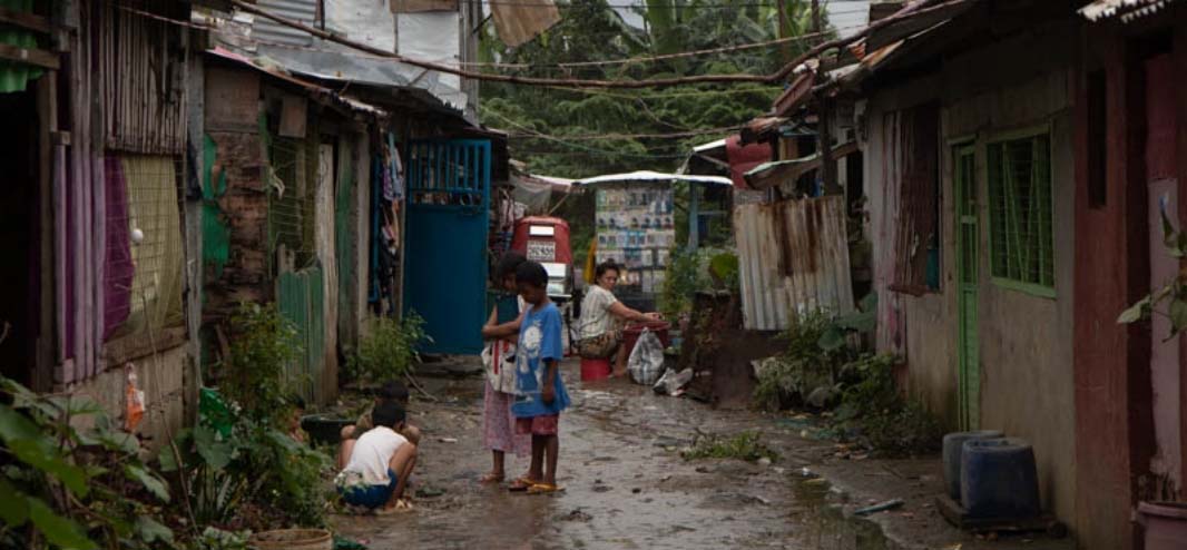 Children play outside houses in Kasiglahan Village in Rodriguez, Rizal on September 11, 2021