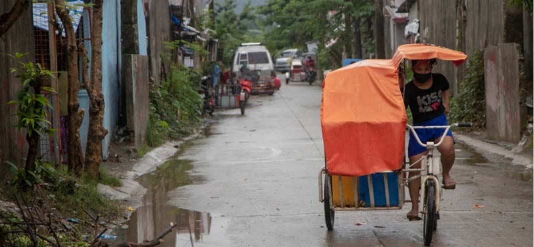 A man drives a pedicab inside Kasiglahan Village in Rodriguez, Rizal.