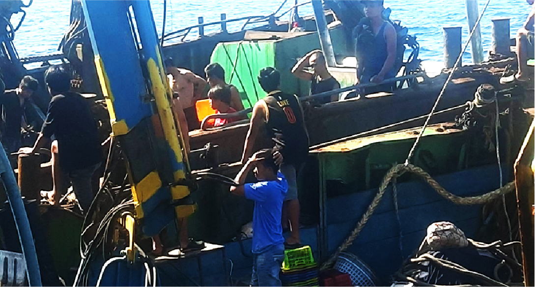 Fishers work on board a Chinese fishing vessel in this undated photo. (Nante Maglangit)