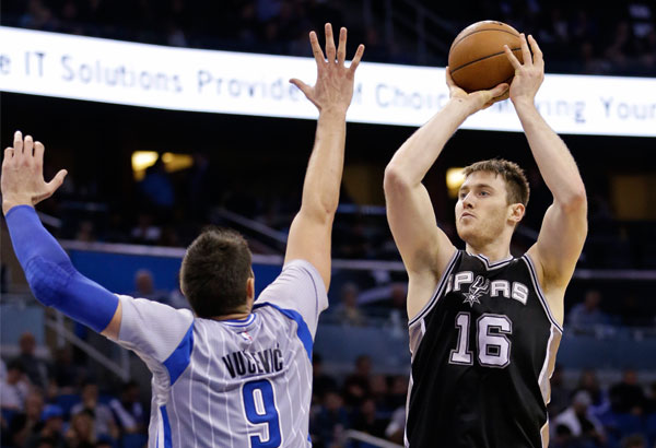 Spurs secure playoff berth with 103-91 win over Magic