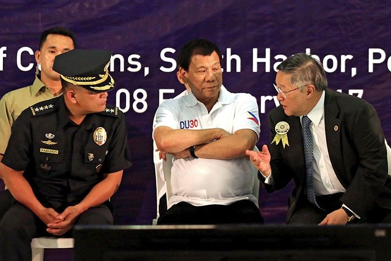 Live simply, Duterte tells BOC employees