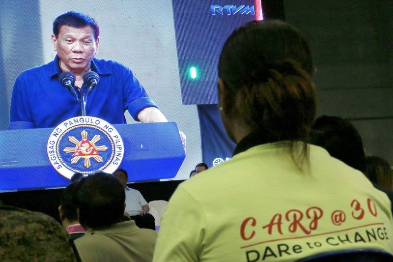 Duterte hands out land titles to former rebels