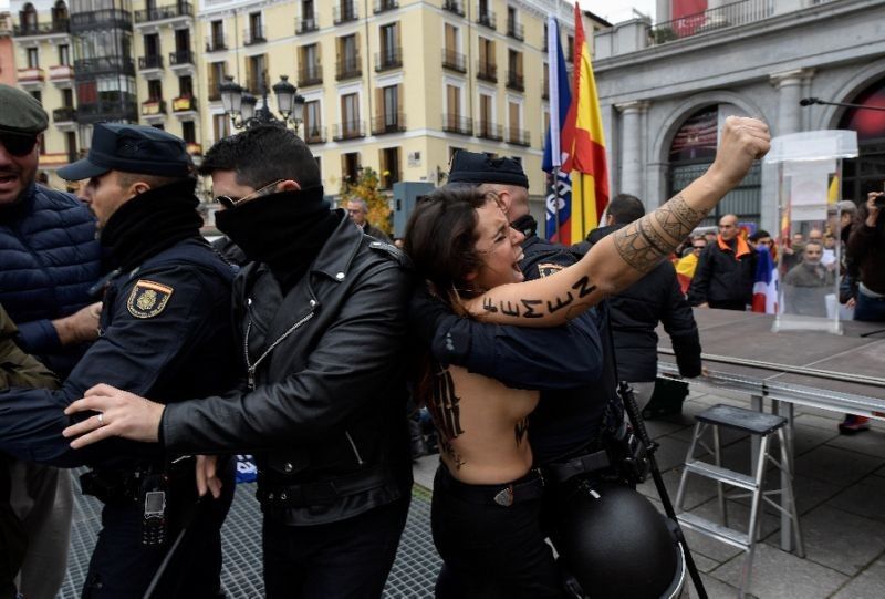 Topless Femen activists disrupt rally of Franco fans in Madrid