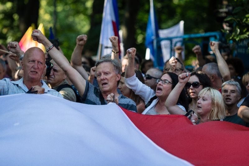 Polish president names top court judges despite protests