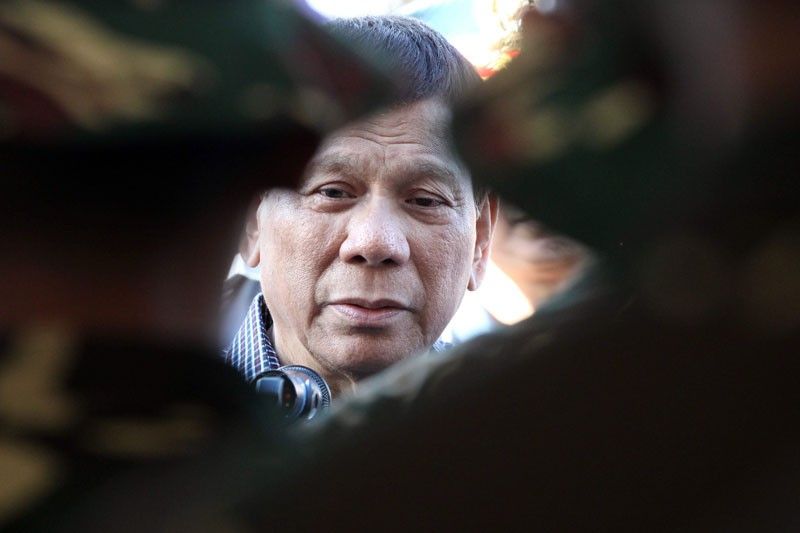 DND chief Lorenzana: â��AFP, PNP solidly behind Duterteâ��