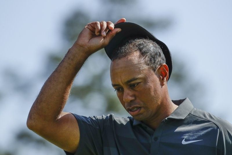 Tiger Woods plods through his 1st Masters round since 2015