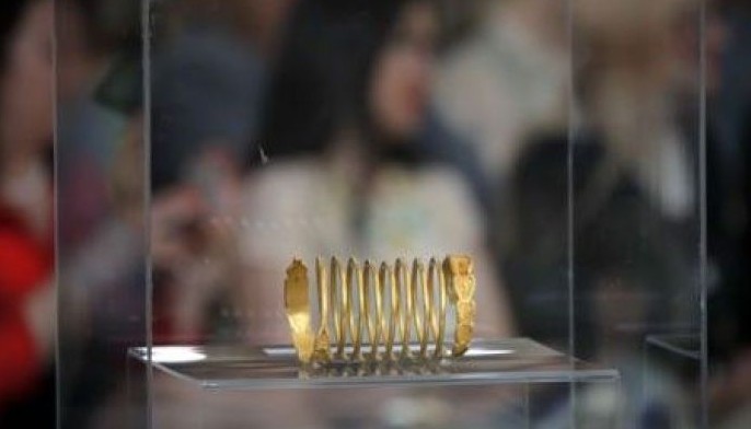 Ancient coins, bracelets looted from Romania return home