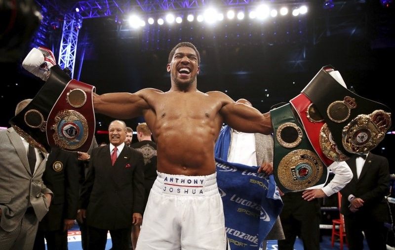Joshua stops Povetkin in 7th round, keeps heavyweight titles