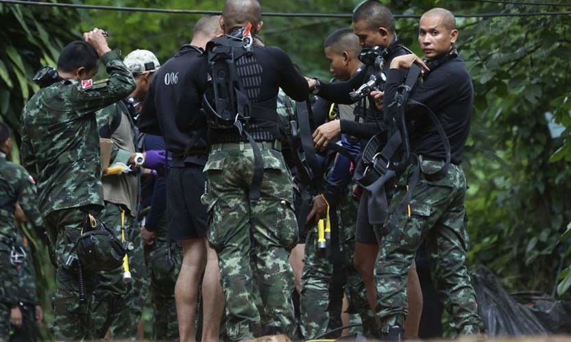 Rescuers race to drain water inside Thai cave before rains