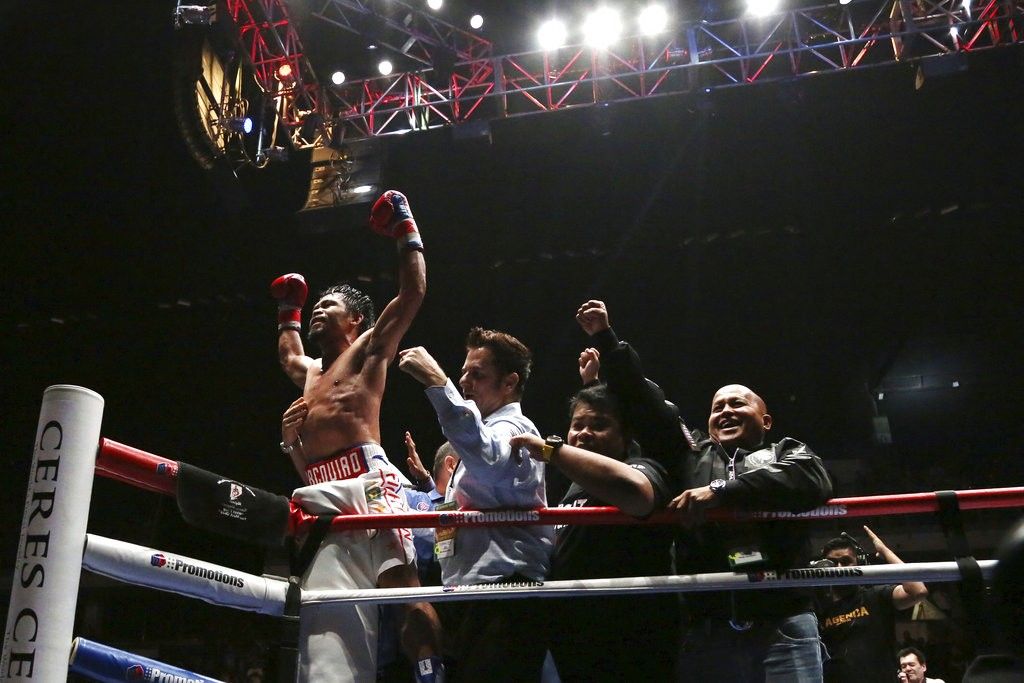 Pacquiao pounds Matthysse, scores 7th round KO to win WBA welterweight title