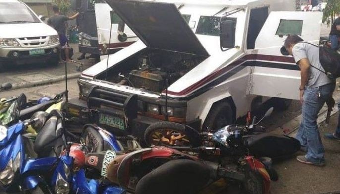 Unmanned van crashes into parked motorbikes