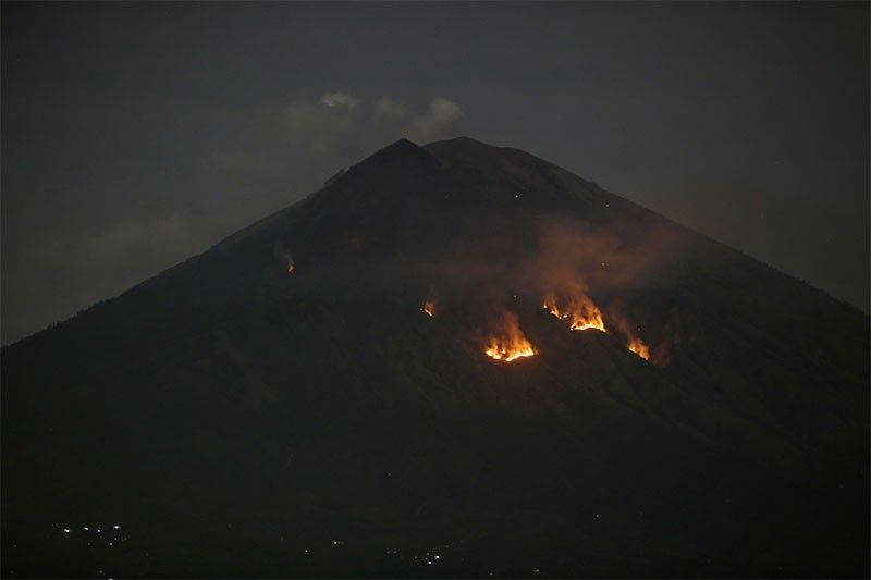 Bali volcano hurls lava and ash, but island's airport normal