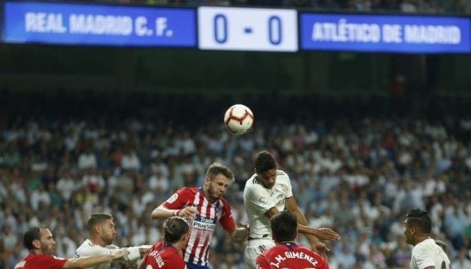 Madrid and Atletico draw in derby, Barcelona stays ahead