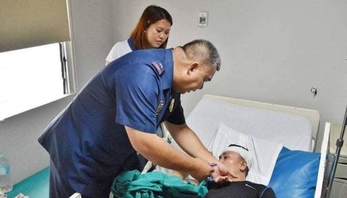 Wounded cop gets cash, medal, hospital assistance