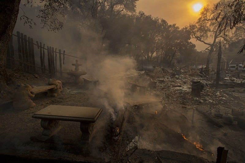 Five die in California wildfires, 150,000 forced to flee