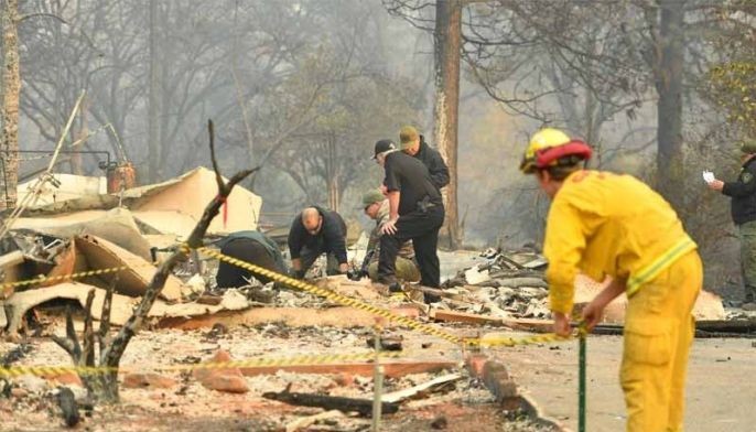 Rescue workers recover bodies in fire-hit California town