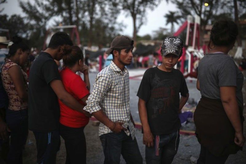 Migrant caravan, raising concerns in US, halts in Mexico