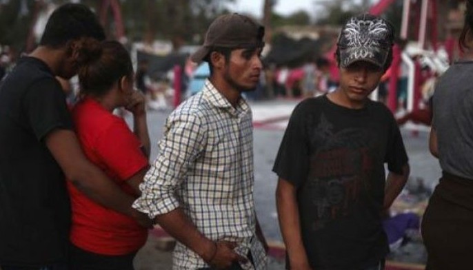 Migrant caravan, raising concerns in US, halts in Mexico