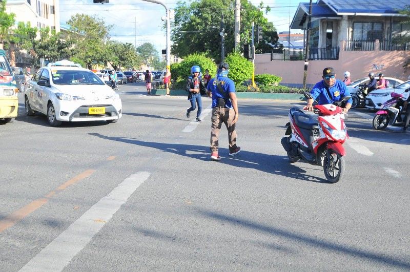 Traffic enforcer hit by motorcycle