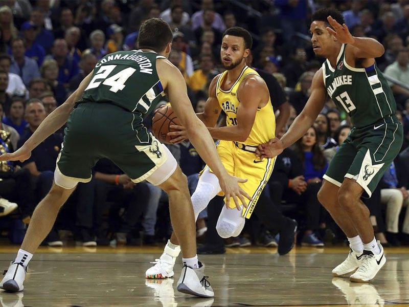 Bucks snap Warriors' 8-game win streak; Curry injured