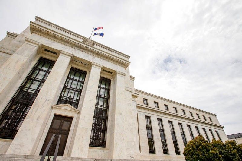 Fed keeps key rate steady but notes rising inflation