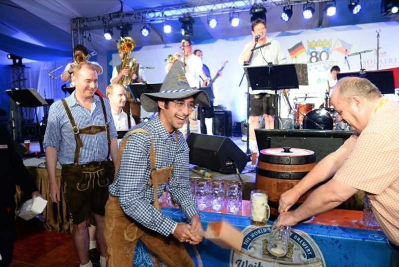 Oktoberfest at Solaire: Drinking beer, watching a German band play funk â as 99 red balloons go by