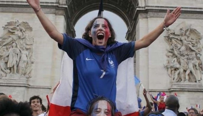 With flags, song, pride, French celebrate unifying victory