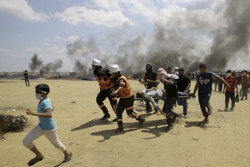 Palestinians bury dead after bloodiest Gaza day since 2014
