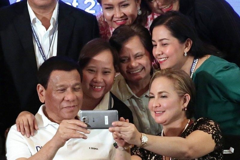 Duterte doesnâ��t mind being spat on by beautiful women