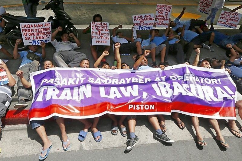 Suspension of TRAIN urged amid â��chokingâ�� economy