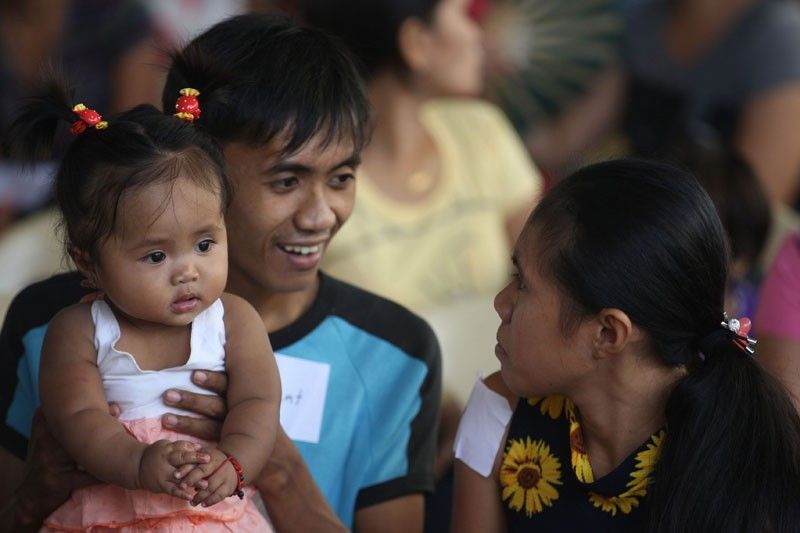 filipino family going to church