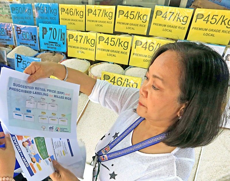 NFA officials released the Suggested Retail Price (SRP) for rice at Trabajo Market in Manila yesterday as the government warns of sanctions against traders and retailers who violate the SRP rule. 