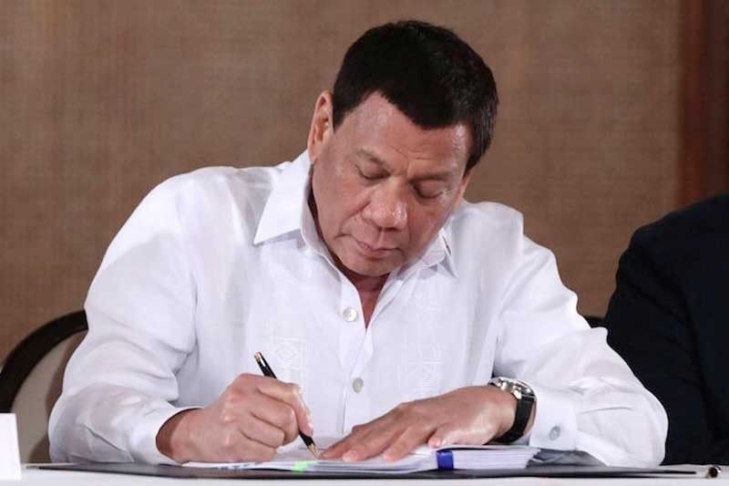 Duterte signs laws creating 2 new congressional districts in Laguna, Aklan