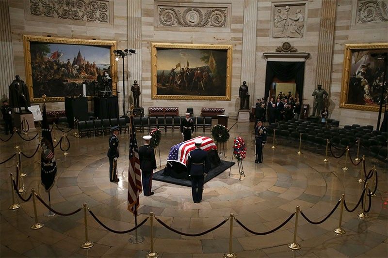 Late president Bush lies in state in Washington