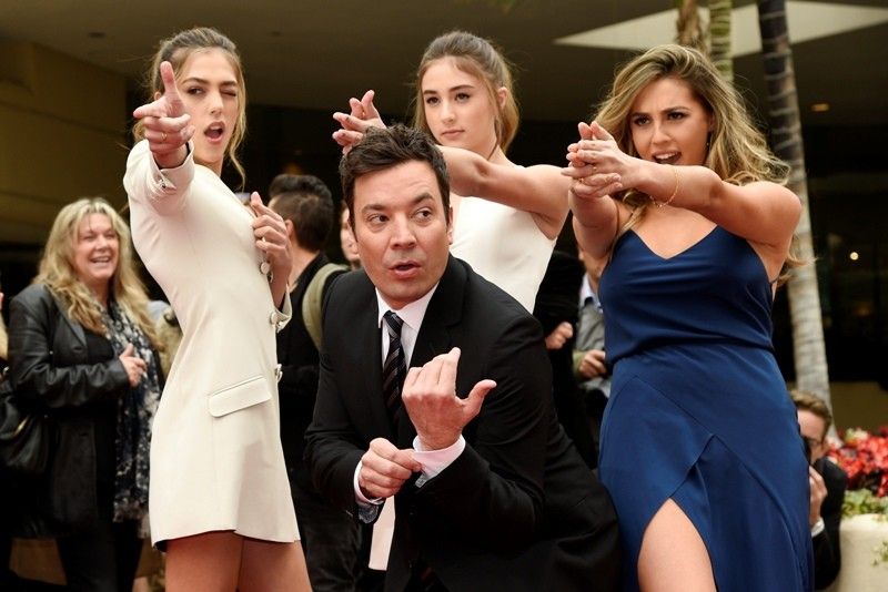 Fallon kicks off Globes with song, dance and Trump jokes