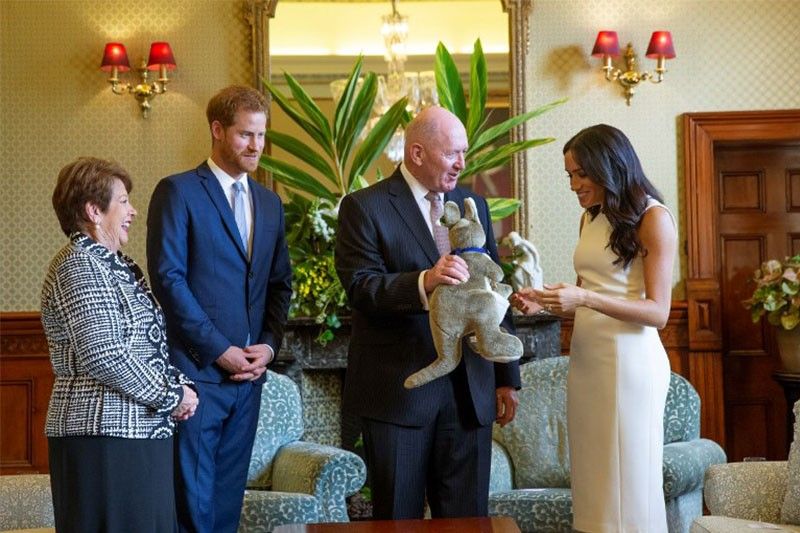 Prince Harry and pregnant Meghan make first public outing