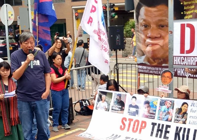 Activists hold protest hours before Duterte meets with Filipinos in Hong Kong