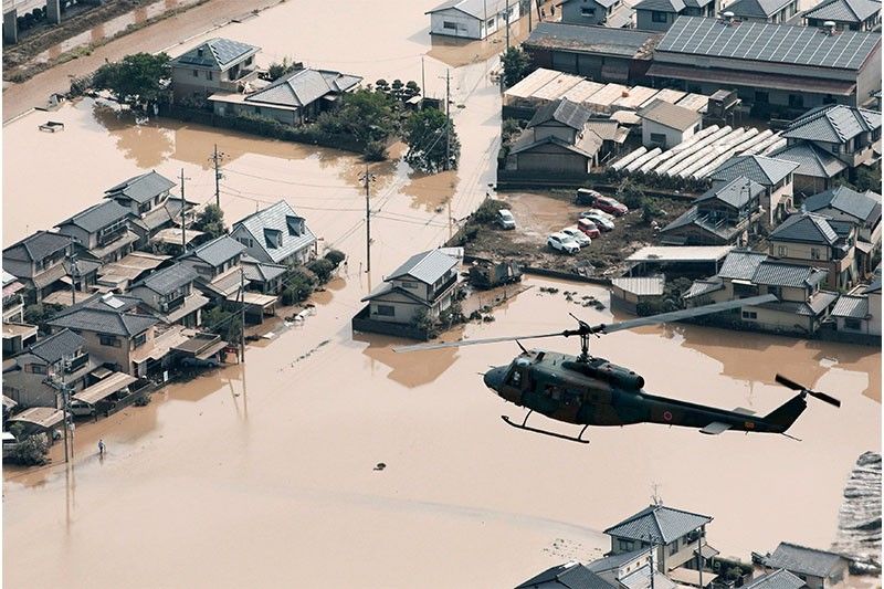 Japan says death toll from floods climbs to 100