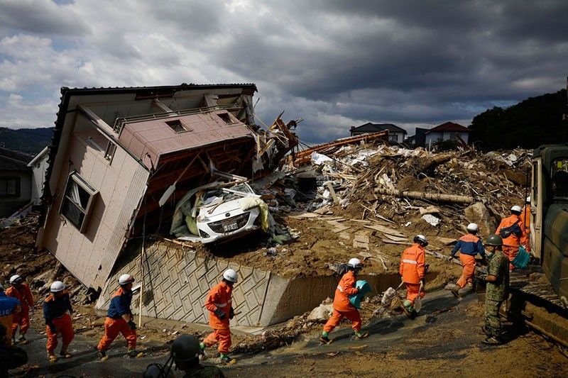 Rescuers comb through mud for Japan flood victims; 134 dead