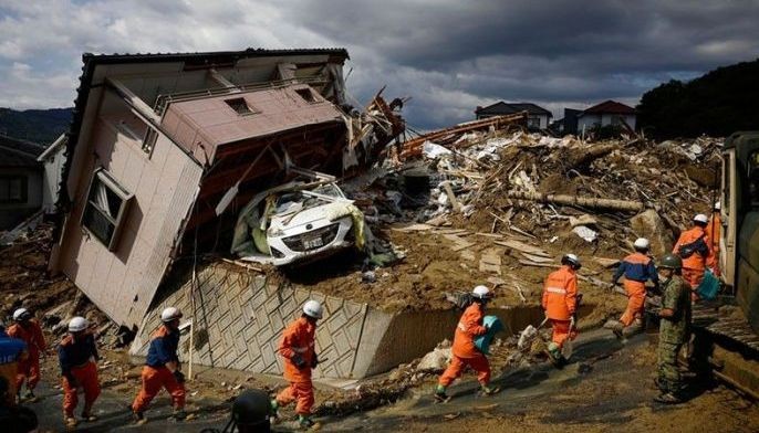 Rescuers comb through mud for Japan flood victims; 134 dead