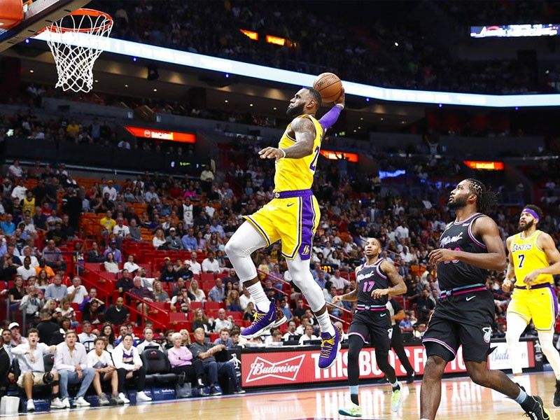 WATCH LeBron  James  poster  comes to life in sneaker store 