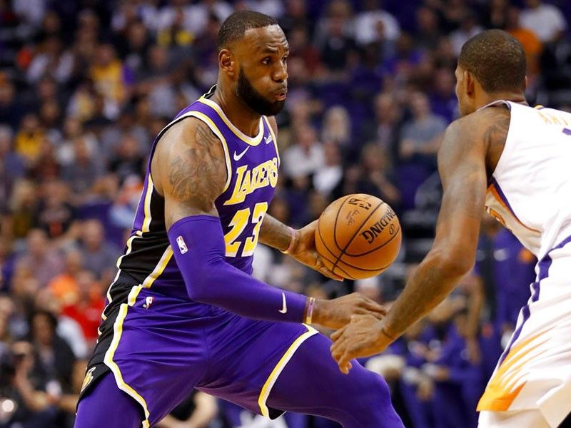 LeBron gets 1st win as a Laker in romp over Suns