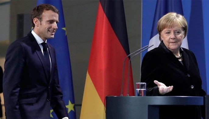 Macron, Merkel seek common approaches to Trump, euro