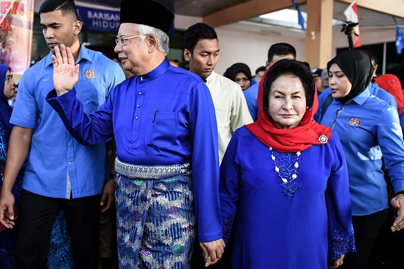 Wife of ex-Malaysian leader charged with money laundering
