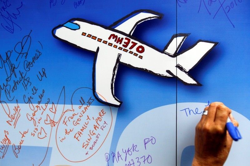 Australia defends end of MH370 hunt; investigation continues
