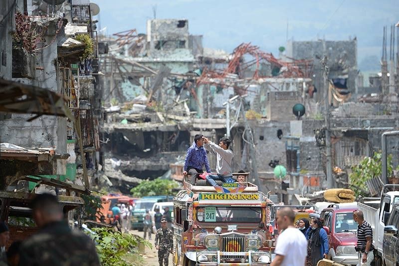Painful homecoming to battle-torn Marawi