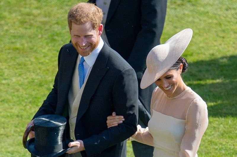 Newlyweds Harry and Meghan make first appearance