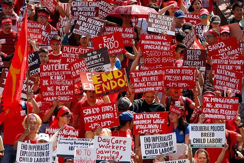 IN PHOTOS: Thousands mark Labor Day with defiant rallies ...